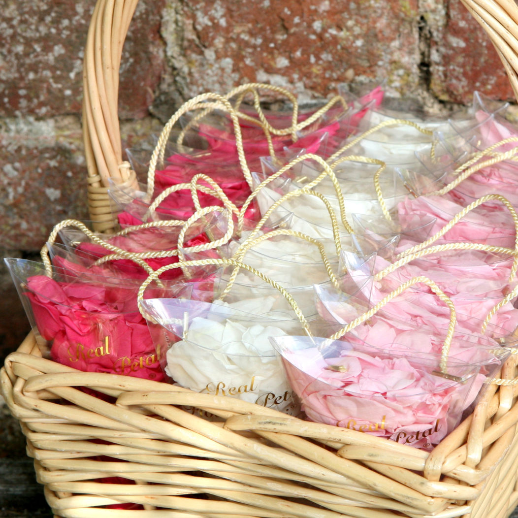 Confetti Sachets placed into a basket is an easy to handle and carry option – great for little bridesmaids. Dark Pink, White and Light Pink Coloured Rose Petal Sachets