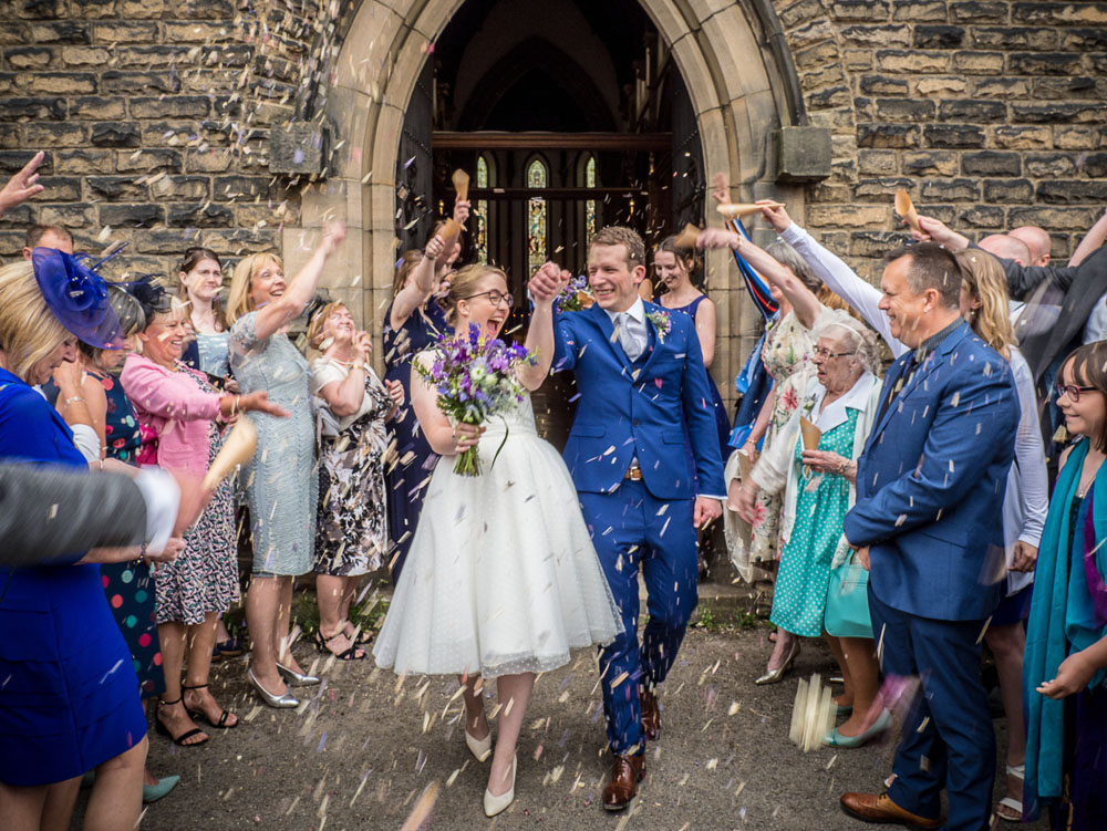 Delphinium Petal Confetti Moment – guests outside the church door Delphinium Petal Confetti Moment - guests outside the church door