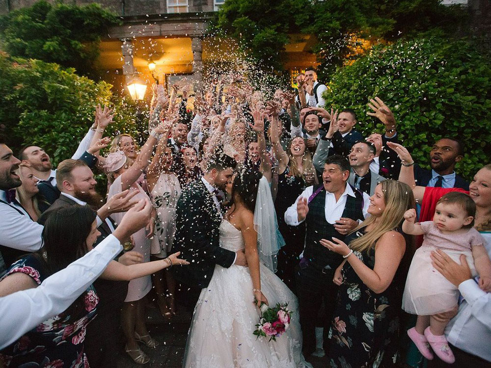 Confetti Moment – an evening confetti throw before the couple leave the party Confetti Moment - an evening confetti throw before the couple leave the party
