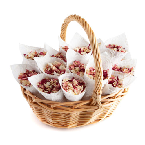 A basket of Ruby Twist biodegradable confetti petals sat in wedding confetti cones.
