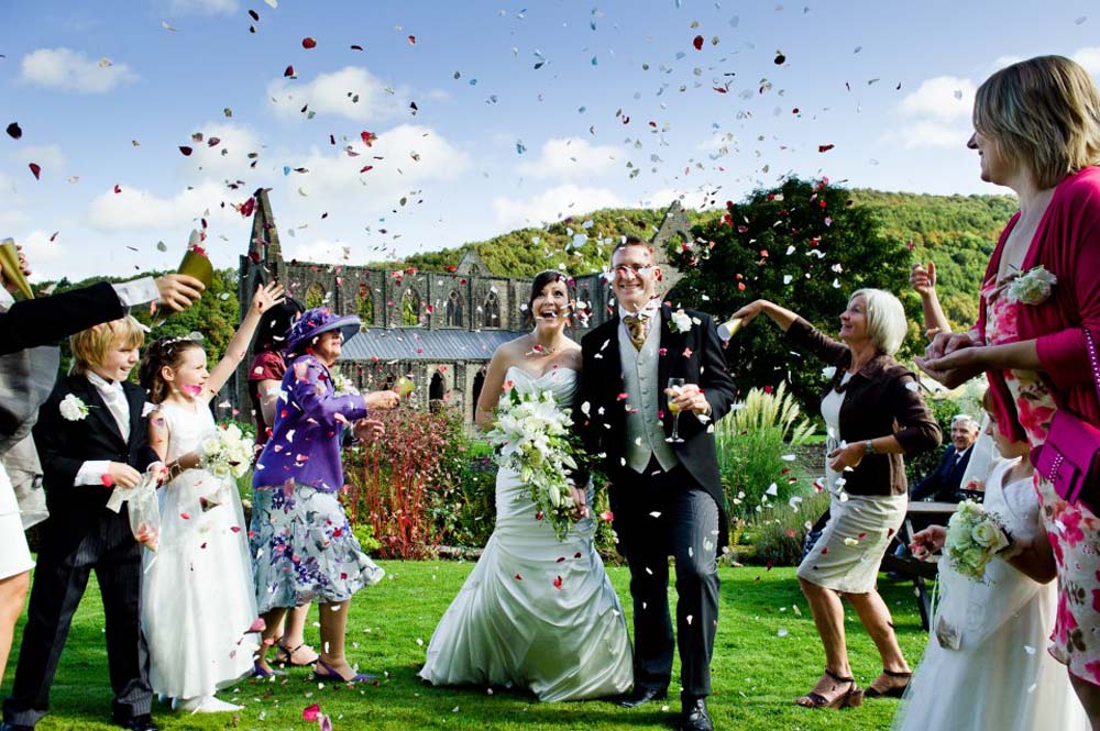 A Rainbow Rose Petal Confetti Moment with an amazing backdrop – Tintern Abbey A Rainbow Rose Petal Confetti Moment with an amazing backdrop - Tintern Abbey